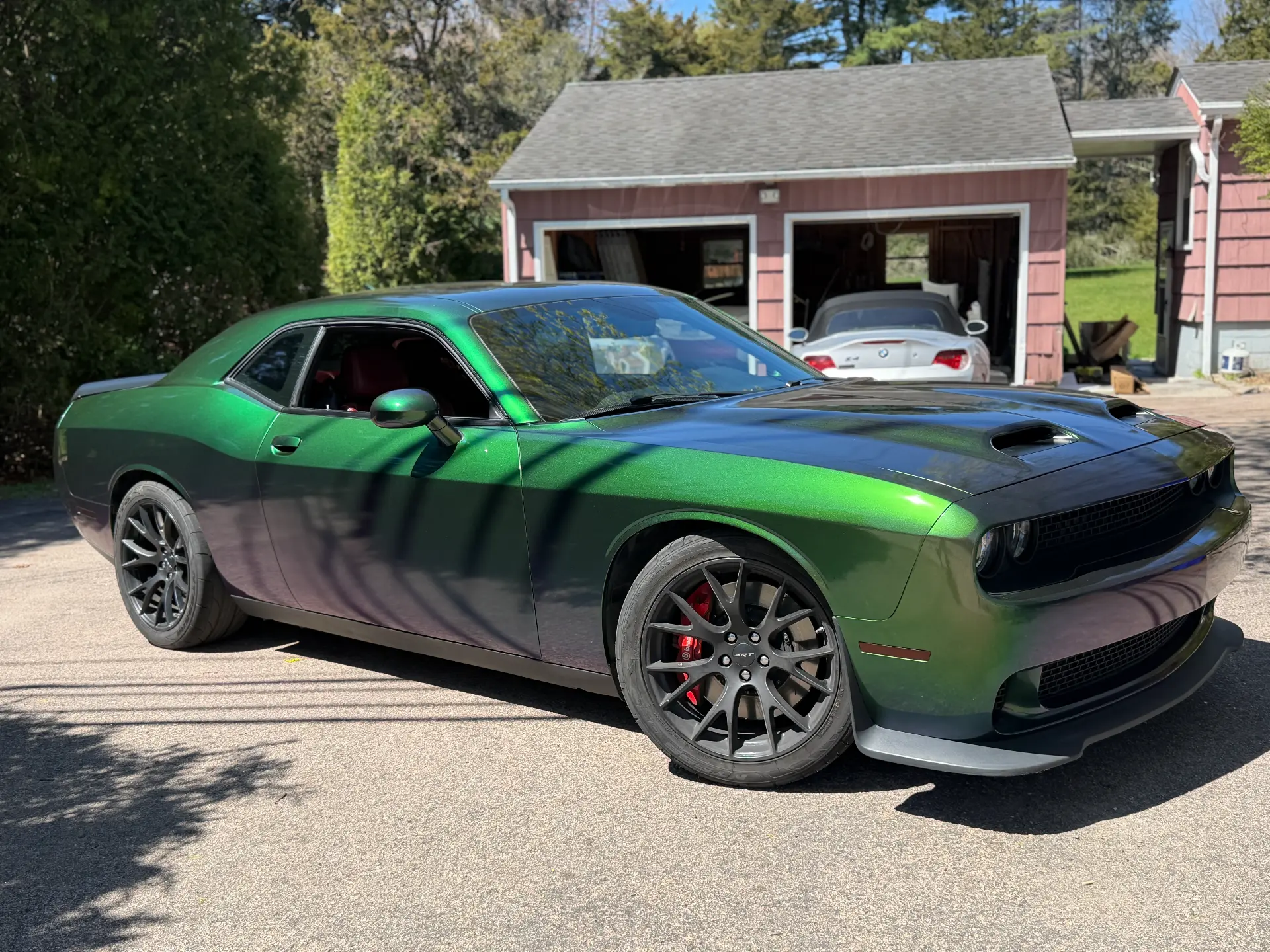 Dodge Challenger SRT wrapped in a green-to-purple color shift vinyl by Vinyl Vision Co.